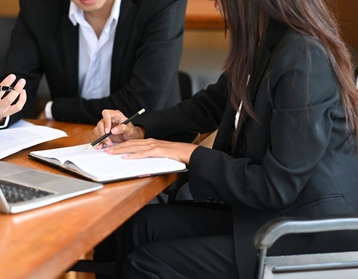 two people filling out paperwork